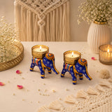 Blue elephant-shaped tea light candle holders with gold accents and floral patterns for diwali and holiday decor