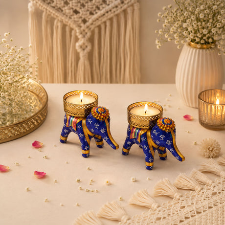 Blue elephant-shaped tea light candle holders with gold accents and floral patterns for diwali and holiday decor