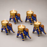Blue elephant-shaped tea light candle holders with gold accents and colorful patterns for diwali and home decor