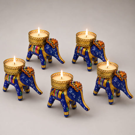 Blue elephant-shaped tea light candle holders with gold accents and colorful patterns for diwali and home decor