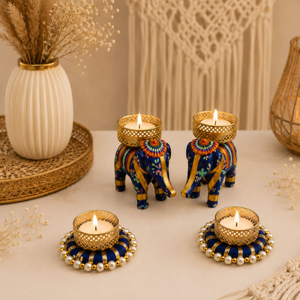 Blue and gold decorative elephant tealight candle holders with intricate floral patterns for festive home decor
