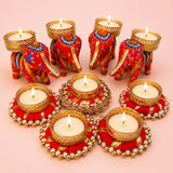 Red and gold embroidered elephant-shaped tealight candle holders with intricate woven patterns for festive home decor