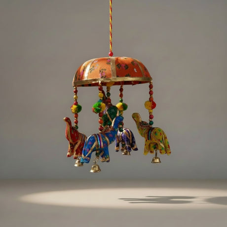 A vibrant handcrafted elephant umbrella door hanging with painted elephants and floral domed canopy for home decor