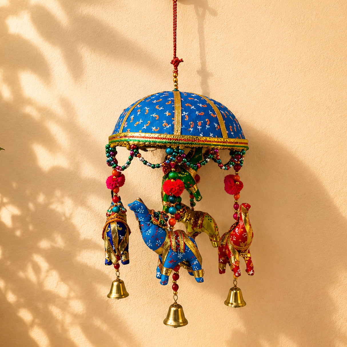 Elephant umbrella door hanging with vibrant blue and gold embroidery featuring decorative elephants beads and bells