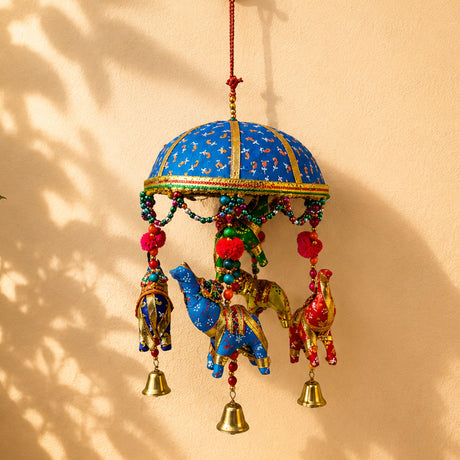 Elephant umbrella door hanging with vibrant blue and gold embroidery featuring decorative elephants beads and bells