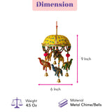 A vibrant yellow dome-shaped elephant umbrella door hanging with painted elephants and bells for home office decor