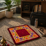 A vibrant red velvet elephant pooja aasan rug with embroidered floral and elephant patterns for meditation and festive decor