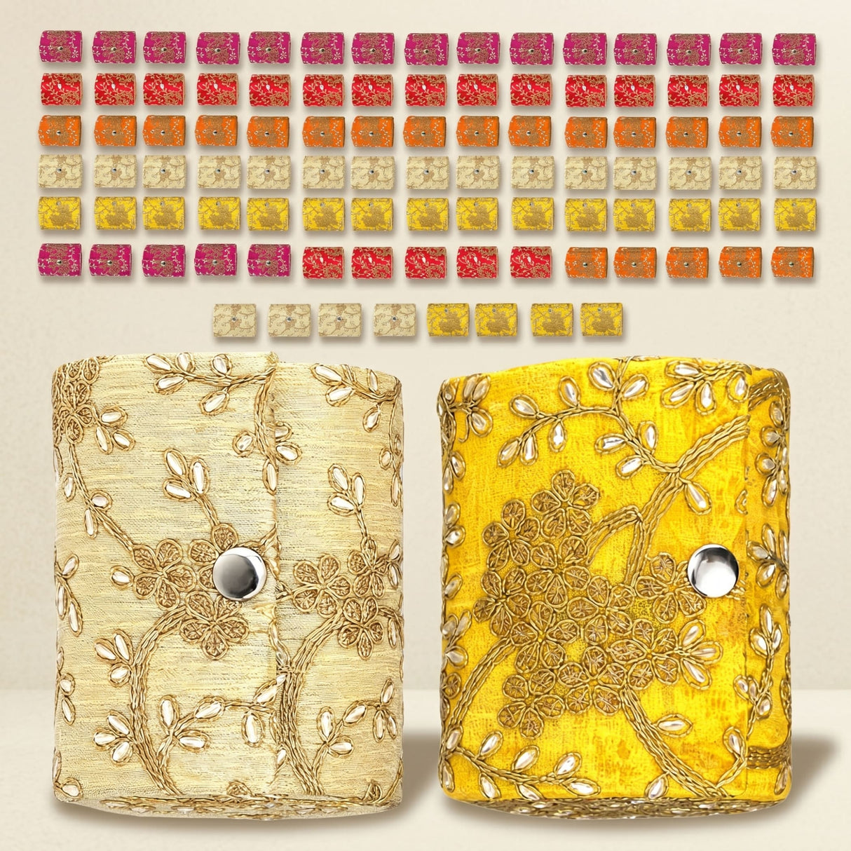 Two embroidered clutch bags in cream and vibrant yellow featured as bangle organizing boxes for jewelry storage