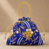 A vibrant royal blue designer potli bag with gold embroidered floral detail and pearl accents for weddings and gifts