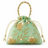 A mint green designer potli bag with gold and cream embroidered floral patterns pearl accents and beaded handle