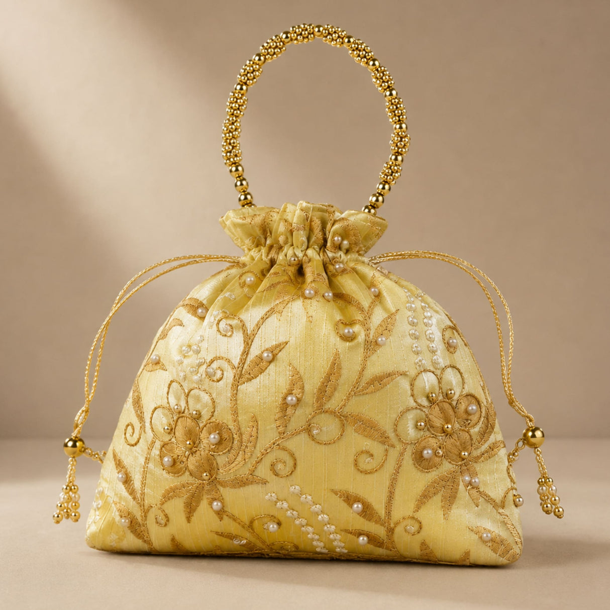 Designer potli bag yellow satin with gold embroidery pearl accents and beaded handle for weddings and jewelry gifts