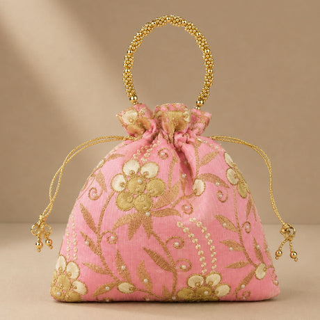 Designer potli bag in pink with embroidered floral detail pearls and gold bead handle for weddings and party favors