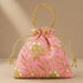 Designer potli bag in pink with embroidered floral detail pearls and gold bead handle for weddings and party favors