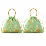 Designer potli bag in mint green with gold floral embroidery and pearl bead accents for weddings and party favors