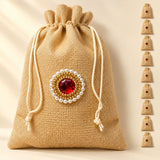 Beige traditional indian jute potli bag with drawstring and red gemstone pearl gold bead work for pooja and festive use