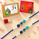 Two blue rakhi bracelets with turquoise navy beads pearls and gold-toned evil eye charms for raksha bandhan gift