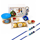 Blue and white rakhi with blue eye beads included in raksha bandhan gift hamper set for bhaiya bhabhi