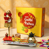 Golden Gudi showpiece with red flowers, gold embellishments, plastic gathi mala and kalash on slender stand