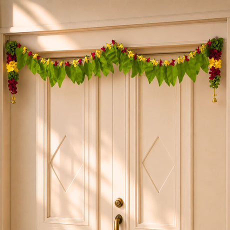 Fabric mango leaf door toran with vibrant green and yellow floral design red accents and golden bells for home pooja decor
