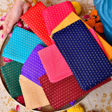 A vibrant collection of unstitched floral multicolor blouse pieces with subtle metallic dots for saree and Indian gifts