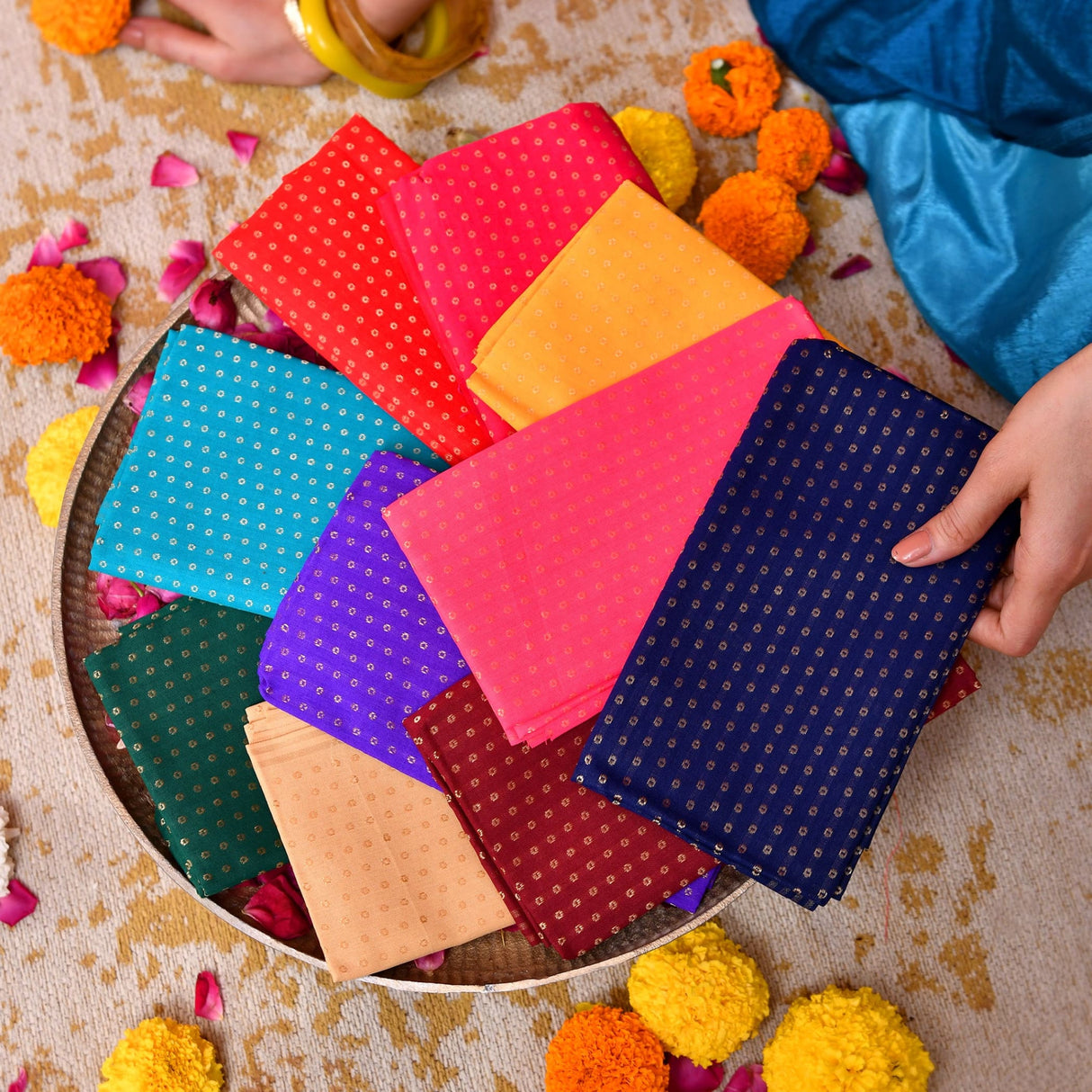 Unstitched floral multicolor blouse pieces in vibrant patterned fabric squares with metallic dot designs for indian gifts