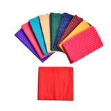 A vibrant red pocket square with subtle white dots complementing unstitched floral multicolor blouse pieces for indian gifts