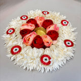 Decorative floral rangoli mat tealight candle holder with white pink and red artificial flowers and golden pearl centerpiece