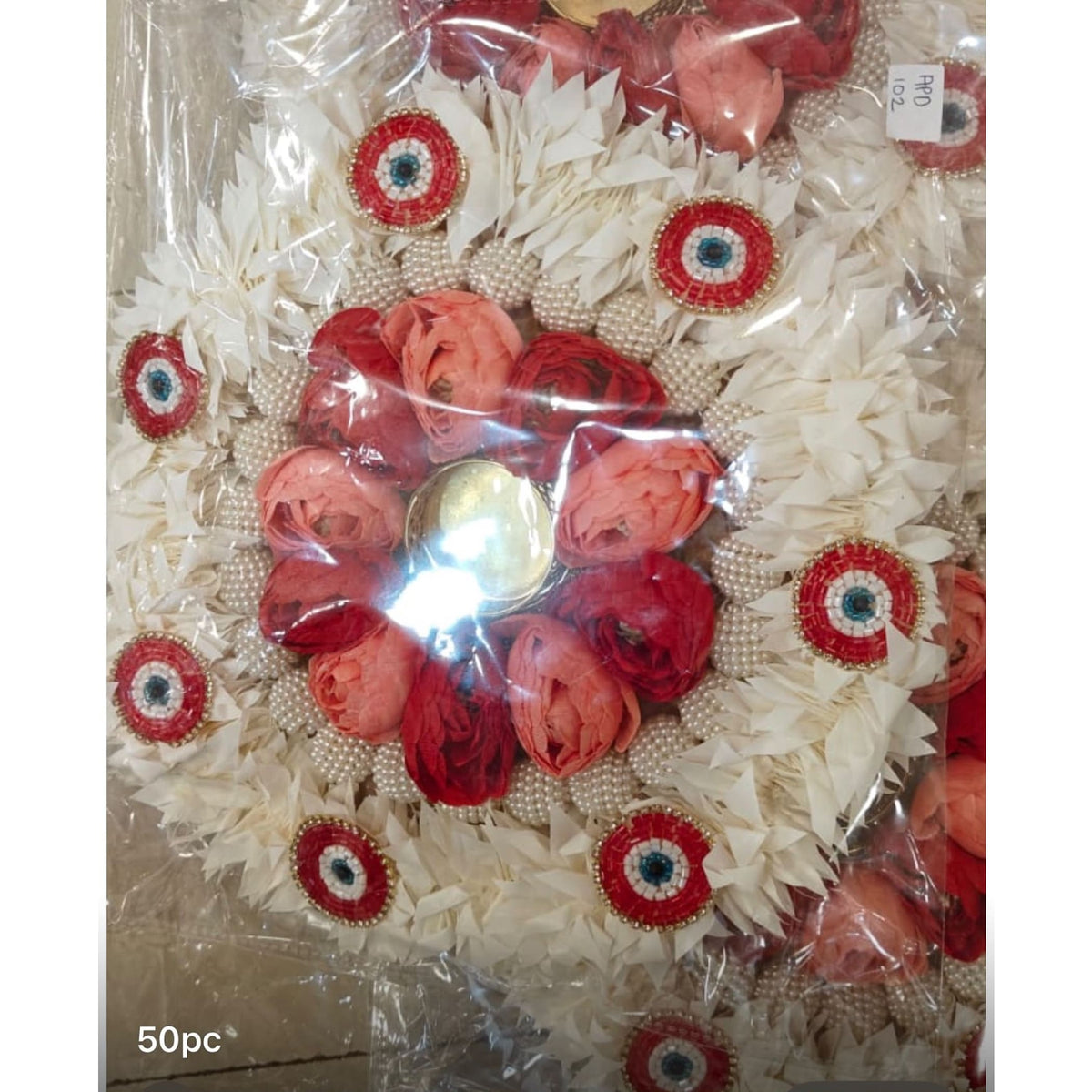 Decorative floral rangoli mat tealight candle holder with coral red roses white paper flowers and pearl bead accents