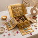 Gold quilted handmade jewelry organizer with transparent zippered pockets holding colorful bangles earrings and necklaces