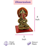 A 4-inch tall plastic ganesh designer supari intricately beaded with a red trunk and golden headpiece for pooja