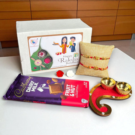 Rakhi Gift Hamper for Brother Bhabhi Raksha Bandhan Set of 2 Ganesha Bracelet Rakhis with Roli Chawal Rakhi Stickers Gift Box Bhaiya Sister In Law Traditional Rakhi Combo - LoveNspire