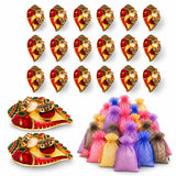 Red and gold ornate ganesha shaped oil lamps with green accents decorative kumkum holders for pooja thali use