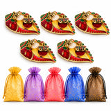 Red and gold ornate chili shaped diya holders with intricate green detailing for pooja thali return gifts and festivals