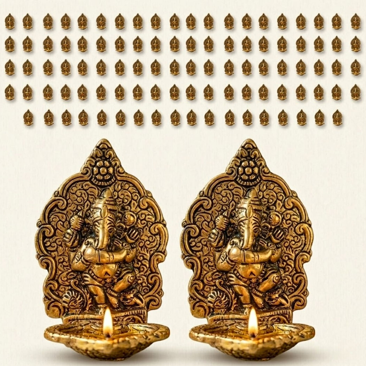 Golden brass ganesha finish diya oil lamps with intricate carvings and lit wicks for diwali temple and home decor