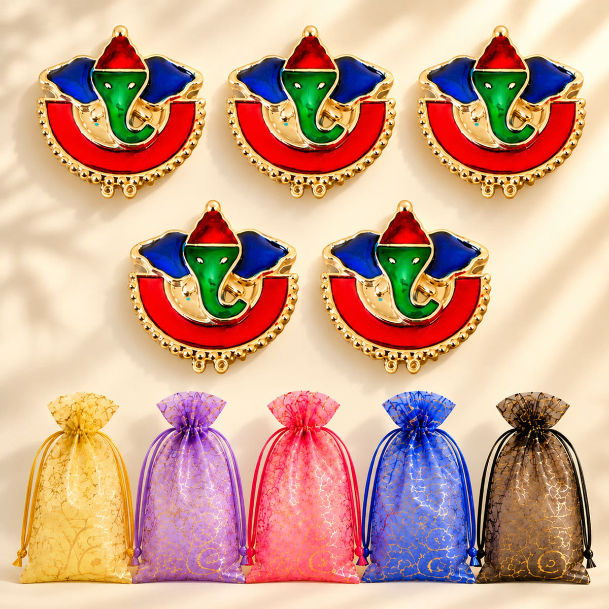 Decorative ganesha enamel pins with gold-tone frames red green and blue accents for pooja thali and Indian gifts