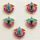 Colorful enamel ganesha-themed haldi kumkum holders with gold-tone metal outlines and glittery pink red teal accents