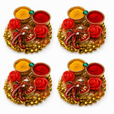 Pack of 4 golden ganesha decorative haldi kumkum thali trays with red rose embellishments and small bells for pooja gifts