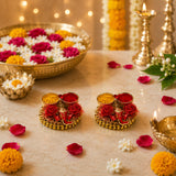 Gold-colored decorative diya holders with red and yellow floral embellishments for Ganesha pooja thali pack of 4