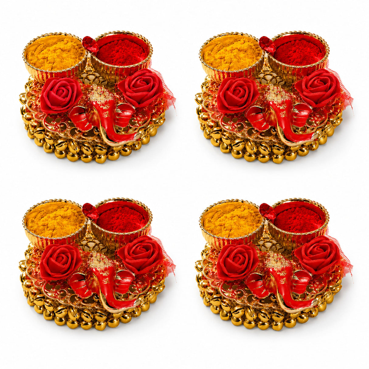 Golden ornamental haldi kumkum thali tray with red and yellow powders, decorative roses, and a small elephant figurine for pooja