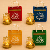 Red, blue, yellow, and green jute gift bags with white ganesha embroidery and gold trim for ganesh chaturthi and diwali gifts
