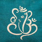 Teal burlap jute bag featuring a cream stylized ganesha om symbol for eco-friendly pooja gift and return favors