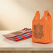 Bright orange non woven reusable shopping bag with brown ganesha print for Indian weddings puja and housewarming