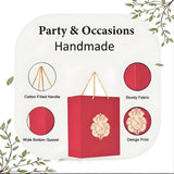 Red handmade paper carry bag with gold-toned ganesha print and cotton handles for wedding and puja gifts 8x4x10 inch