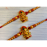 Handcrafted golden ganesha rakhi bracelet set with red thread and embellished beads for raksha bandhan gift
