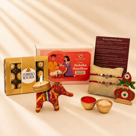Red and gold embroidered elephant-shaped candle holder with intricate patterns from designer ganesha rakhi gift hamper