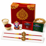 Red and gold ornate brocade gift box with intricate damask pattern for raksha bandhan hamper for brother and bhabhi