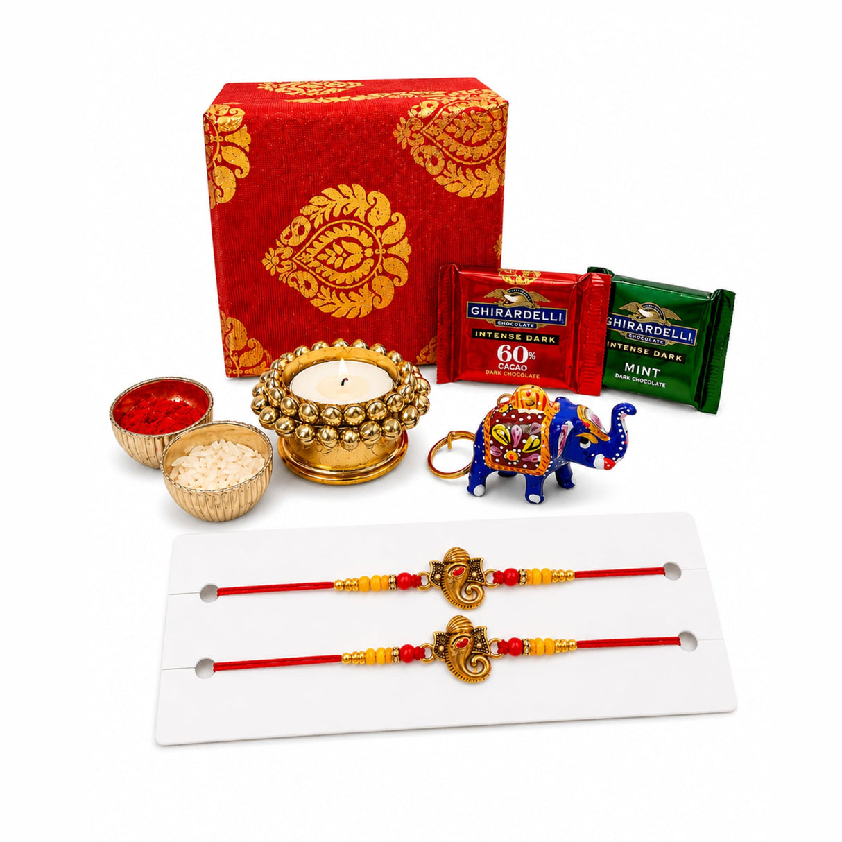 Gold-colored elephant-shaped keychain with intricate colorful patterns and decorative ring from raksha bandhan brocade gift box hamper