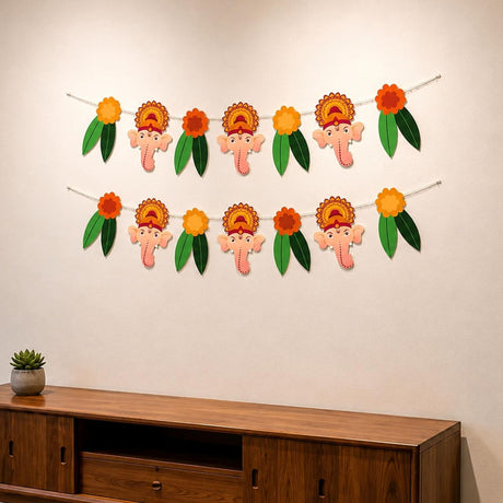 A cheerful two-row garland with pink elephant faces and orange yellow floral headdresses for ganesh chathurti decor