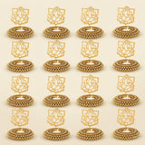 Golden ganesha-themed tealight candle holders with intricate beadwork and ornate detailing for festive home decor