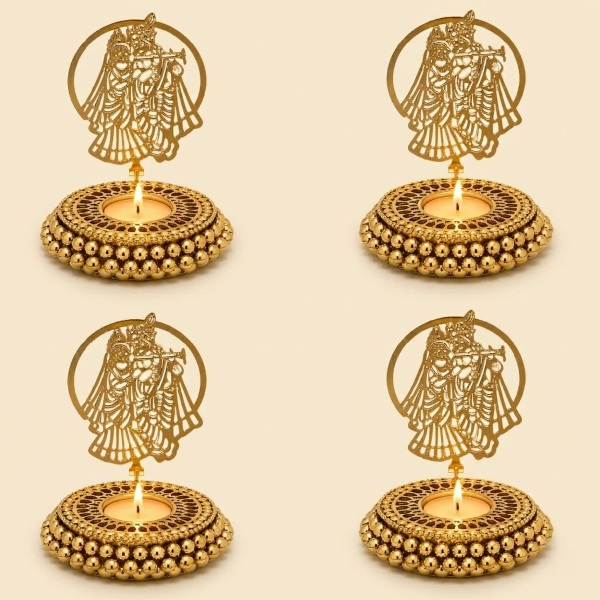 Golden metallic tealight candle holders with intricate couple cut-out designs and beaded bases for festive home decor